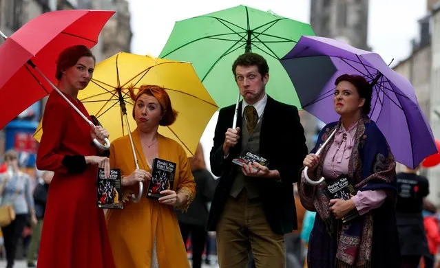 Performers hand out flyers on the The Royal Mile trying to attract people to their show, in Edinburgh, Scotland, Britain on August 1, 2019. (Photo by Russell Cheyne/Reuters)