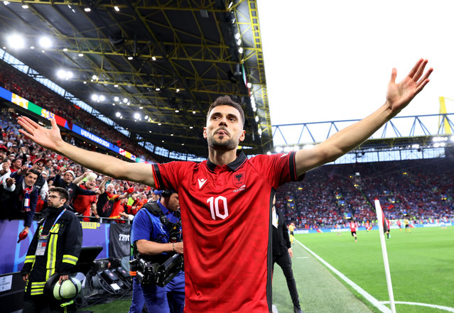 Albania's midfielder #10 Nedim Bajrami celebrates scoring his team's first goal during the UEFA Euro 2024 Group B football match between Italy and Albania at the BVB Stadion in Dortmund on June 15, 2024. (Photo by Bernadett Szabo/Reuters)