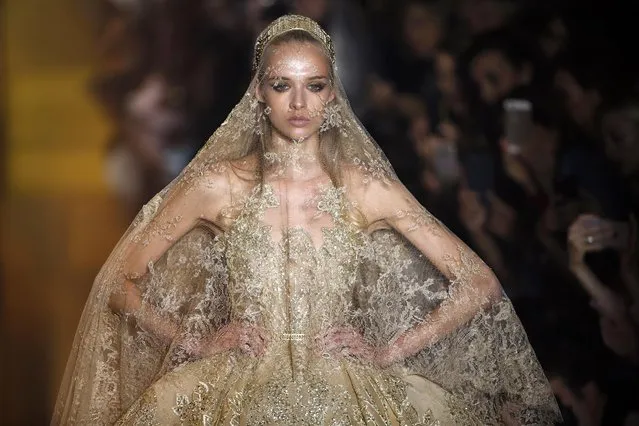 A model presents a wedding dress creation by Lebanese designer Elie Saab as part of his Haute Couture Fall Winter 2015/2016 fashion show in Paris, France, July 8, 2015. (Photo by Charles Platiau/Reuters)
