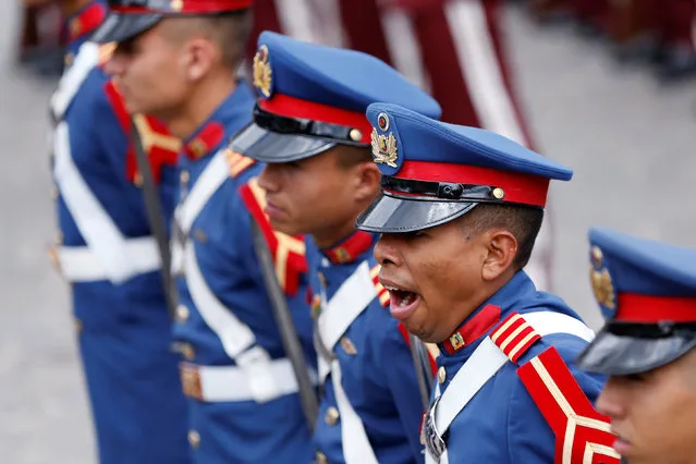 A Venezuelan soldier yawns during a ceremony at the National Pantheon in Caracas, Venezuela, May 10, 2016. (Photo by Carlos Garcia Rawlins/Reuters)