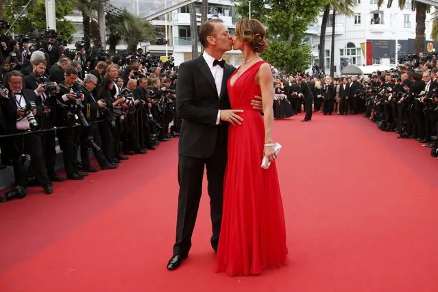 Rocco Siffredi and his wife pose on the red carpet as they arrive for the screening of the film “Money Monster” out of competition during the 69th Cannes Film Festival in Cannes, France, May 12, 2016. (Photo by Jean-Paul Pelissier/Reuters)