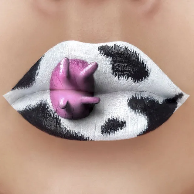 Tutushka's lipstick art work on her lips showing a cow. (Photo by Tutushka Matviienko/Caters News Agency)