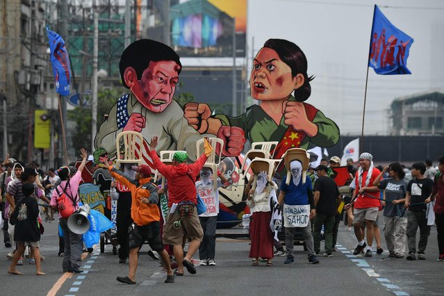 Effigies of Philippine President Ferdinand Marcos (L) and Vice President Sara Duterte are seen as protesters march to congress during a demonstration coinciding with Philippine President Ferdinand Marcos’ State of the Nation Address, in Manila on July 22, 2024. (Photo by Ted Aljibe/AFP Photo)