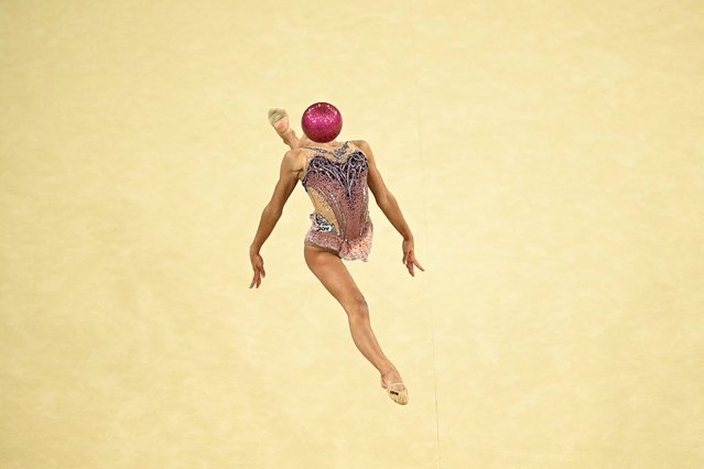 Italy's Sofia Raffaeli performs with the ball in the rhytmic gymnastics' individual all-around qualification during the Paris 2024 Olympic Games at the Porte de la Chapelle Arena in Paris, on August 8, 2024. (Photo by Gabriel Bouys/AFP Photo)