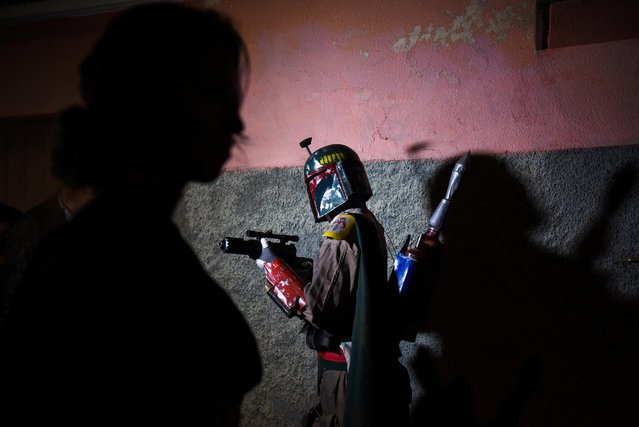 A person dressed in a Boba Fett costume prepares for the International Star Wars Day, in La Paz, Bolivia on May 3, 2023. (Photo by Claudia Morales/Reuters)