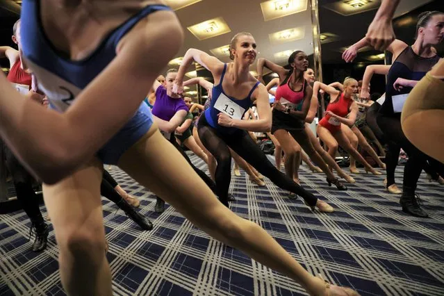 Dancers learn their dance moves during auditions for a spot on the Rockettes line for the “2022 Christmas Spectacular Starring the Radio City Rockettes” at Radio City Music Hall in Manhattan, New York City, U.S., April 18, 2022. (Photo by Andrew Kelly/Reuters)