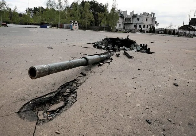 A destroyed Russian tank's turret is seen stuck in the ground, amid Russian invasion of Ukraine in Zalissia, Kyiv region, Ukraine on May 3, 2022. (Photo by Zohra Bensemra/Reuters)