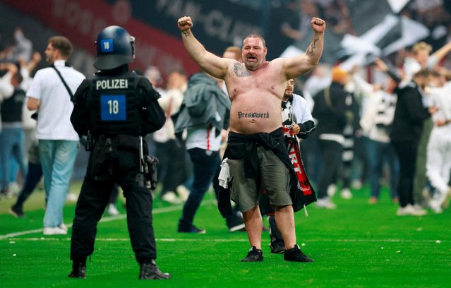 An Eintracht Frankfurt fan celebrates on the pitch after the match with West Ham United, Deutsche Bank Park, Frankfurt, Germany on May 5, 2022. (Photo by Peter Cziborra/Action Images via Reuters)