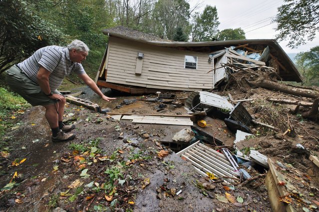 Scott Richardson points to where his home’s foundation once stood as he surveys his collapsed and destroyed house in the aftermath of Tropical Storm Helene, in Boone, North Carolina, U.S. September 28, 2024. (Photo by Jonathan Drake/Reuters)