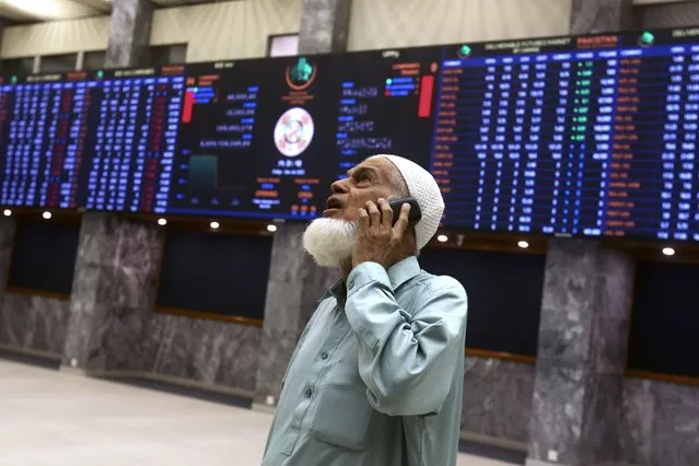 An investor monitors Index on the big screen at at the Pakistan Stock Exchange (PSE), in Karachi, Pakistan, Friday, June 24, 2022. Pakistan's stock market suddenly fell by three percent on Friday, shortly after the government of recently elected Prime Minister Shahbaz Sharif suddenly announced the imposition of additional taxes on the corporate and banking sector in an effort aimed at stabilizing the country's fledgling economy. (Photo by Fareed Khan/AP Photo)
