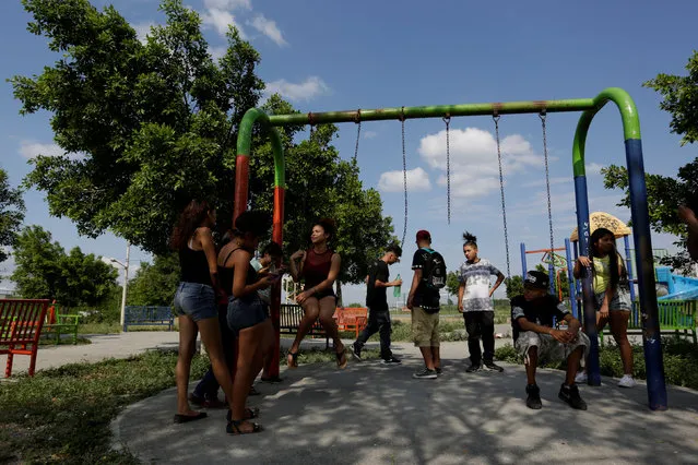 Young people, who attend the meetings of Raza Nueva in Christ, a project of the archdiocese of Monterrey, spend time at a park in the municipality of Juarez, on the outskirts of Monterrey, Mexico, June 25, 2016. (Photo by Daniel Becerril/Reuters)