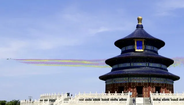 Military aircraft fly past the Temple of Heaven during the military parade marking the 70th anniversary of the end of World War Two, in Beijing, China, September 3, 2015. (Photo by Reuters/Stringer)