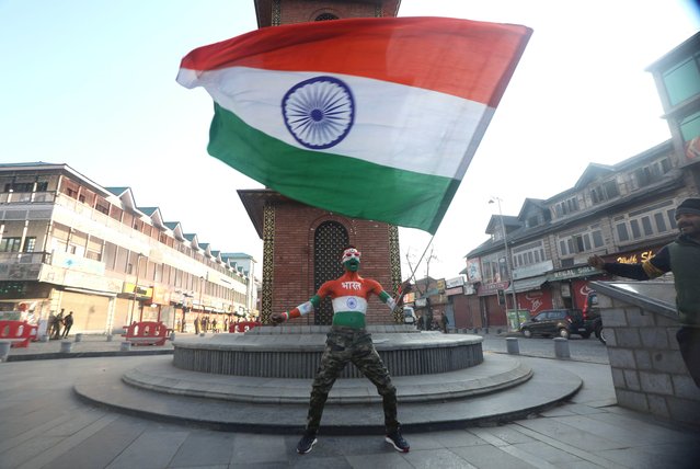 An activist of Akhil Bharatiya Vidyarthi Parishad (ABVP), a student organisation of Rashtriya Swayamsevak Sangh (RSS) waves India's national flag as he celebrates during Republic Day celebrations in Srinagar, the summer capital of Indian Kashmir, India, 26 January 2025. (Photo by Farooq Khan/EPA/EFE)
