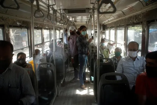 Commuters are seen inside a public transport bus after some restrictions were lifted during a nationwide lockdown to slow the spread of the coronavirus disease (COVID-19), in Mumbai, India, June 8, 2020. (Photo by Francis Mascarenhas/Reuters)