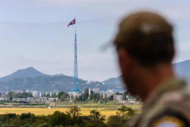 A United Nations Command (UNC) soldier looks at a view of North Korea near the truce village of Panmunjom inside the demilitarized zone (DMZ) separating the two Koreas, on October 4, 2022. North Korea fired a mid-range ballistic missile on October 4, which flew over Japan, Seoul and Tokyo said, a significant escalation as Pyongyang ramps up its record-breaking weapons-testing blitz. (Photo by Anthony Wallace/AFP Photo)