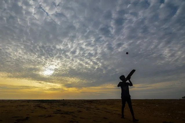 A boy play cricket on the beach Near Colombo, Sri Lanka on July 27, 2020 (Photo by Akila Jayawardana/NurPhoto via Getty Images)