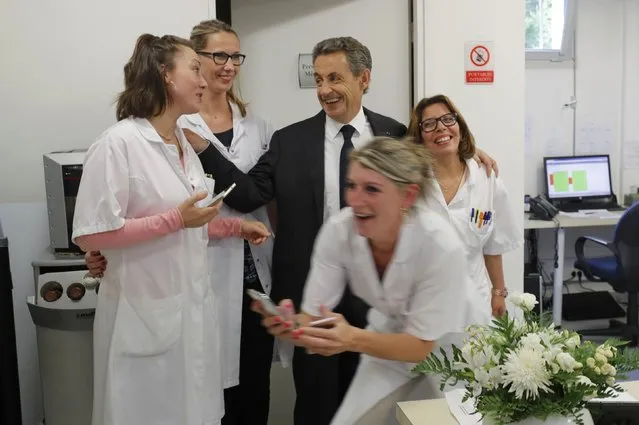 Nicolas Sarkozy, former head of the Les Republicains political party, visits a radiology center in Franconville, France, as part of his campaign for the French conservative presidential primary, September 19, 2016. (Photo by Philippe Wojazer/Reuters)