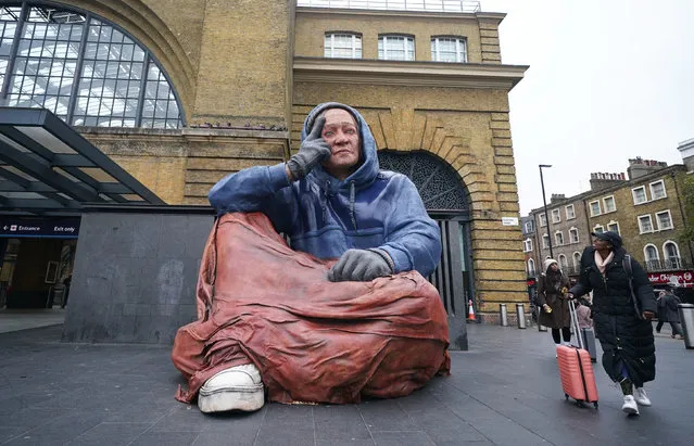 Homeless charity Crisis unveil a 4.3 metre tall hyper-real sculpture of a person experiencing homelessness, at London King's Cross station in London on Monday, December 5, 2022. (Photo by Yui Mok/PA Images via Getty Images)