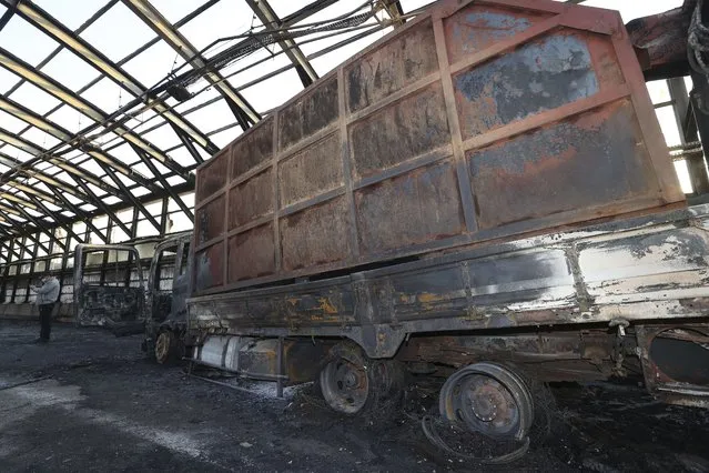 A burned out truck is seen at the scene in Gwacheon, South Korea, Thursday, December 29, 2022. A freight truck collided with a bus on a highway near Seoul on Thursday, causing a fire that killed multiple people and injuring dozens of others, officials said. (Photo by Shin Hyun-woo/Yonhap via AP Photo)