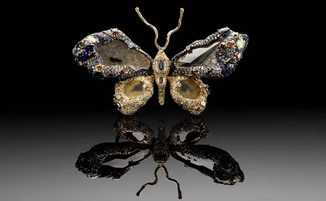 On Wednesday, March 5, 2013, the Smithsonian's National Museum of Natural History will put on display the newest addition to its famous gem collection with a butterfly brooch made of 2,300 gems. The “Royal Butterfly Brooch”, seen in an undated photo, was created in 2009 by Taiwanese jewelry artist Cindy Chao. She is donating the piece to the museum, making it the first Taiwanese-designed item in the National Gem Collection. The Royal Butterfly is composed of 2,328 gems, totaling 77 carats. It includes colored and color-changing sapphires and diamonds, rubies and tsavorite garnets. The centerpieces of the butterfly's wings are four large-faceted diamond slices. (Photo by Don Hurlbert/Smithsonian' Instutution)