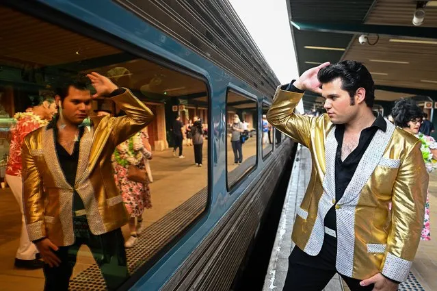 An Elvis impersonator is reflected in the window of the Elvis Express at Central Station in Sydney, Australia, on Thursday, January 5, 2023. Hundreds of Parkes Elvis Festival attendees will board the Elvis Express train from Sydney's Central Station on Thursday for a windy 450-kilometre journey to the central west. (Photo by Steven Saphore/Anadolu Agency via Getty Images)