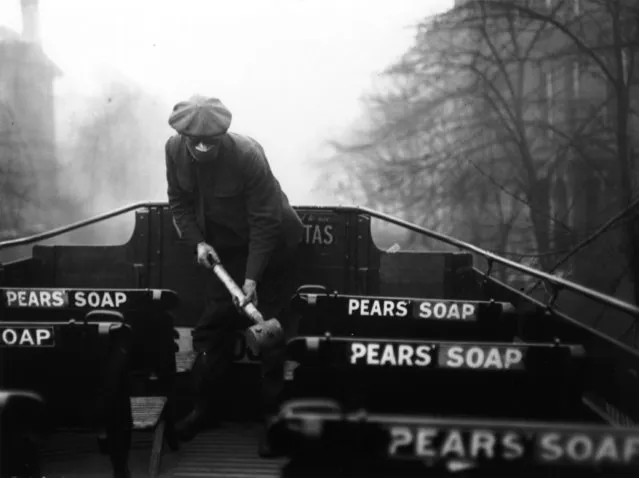 A man spraying the top of a bus with an anti-flu virus during an epidemic which followed World War I, 1920. (Photo by Davis/Getty Images)