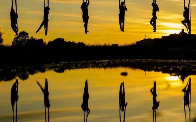 Members of Triko Circus Theater perform aerial hammock dance by hanging from the Mladost Bridge over Sava River in Zagreb, Croatia, on June 11, 2020. (Photo by Xinhua News Agency/Rex Features/Shutterstock)