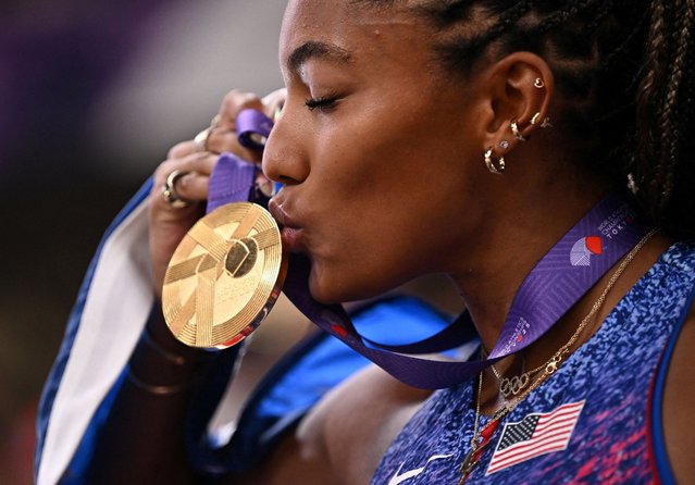Tara Davis-Woodhall of the United States celebrates her victory after winning the Gold medal in the Women's Long Jump on day two of the World Athletics Championships Tokyo 2025 at National Stadium on September 14, 2025 in Tokyo, Japan. (Photo by Dylan Martinez/Reuters)