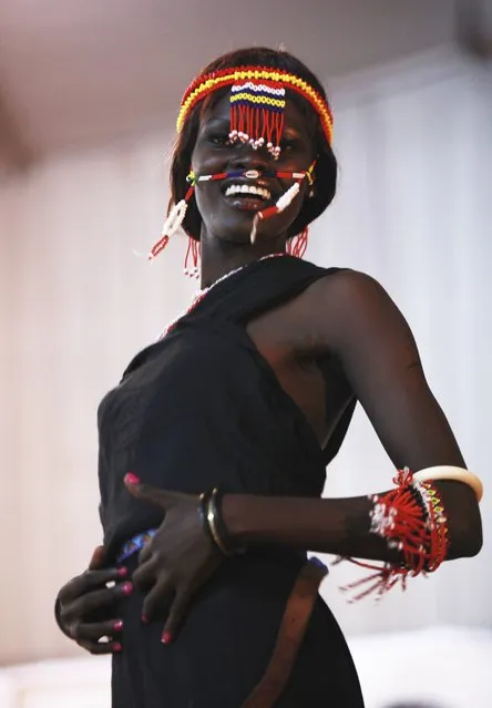 A South Sudanese model walks along a catwalk wearing a traditional outfit during the Miss World South Sudan contest in Juba, South Sudan, April 13, 2013. The finals of the Miss World contest will take place in September in Indonesia. Picture taken April 13, 2013. (Photo by Andreea Campeanu/Reuters)