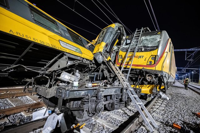 A handout photo made available by the Czech Fire Department showing rescuers working at the scene of a train crash in the city of Pardubice, Czech Republic, 05 June 2024. An express train and a freight train collided head-on in Pardubice late 05 June evening. According to Czech Interior Ministr Vit Rakusan, four people have died at the scene. Dozens of people have been injured, some seriously. More than 300 people were travelling on the passenger train from Prague to Kosice, Slovakia. (Photo by Czech Fire Department/EPA/EFE)