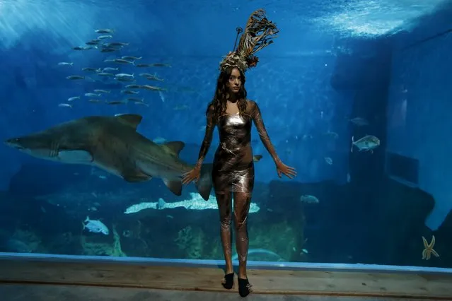 A model wearing a creation by Luis Benitez poses during an urban shoot as part of Andalucia de Moda (Andalusia Fashion) at the aquarium of Seville, southern Spain, November 11, 2015. (Photo by Marcelo del Pozo/Reuters)