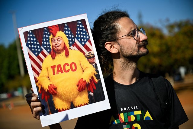 A demonstrator holds a placard depicting U.S. President Donald Trump during a protest against the tariffs on Brazilian products imposed by Trump, in front of the United States Embassy in Brasilia, Brazil, on August 1, 2025. (Photo by Mateus Bonomi/Reuters)