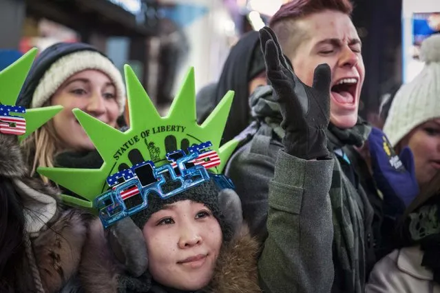 Revellers sport 2015 glasses while taking part in New Year's Eve celebrations in Times Square, New York December 31, 2014. (Photo by Stephanie Keith/Reuters)
