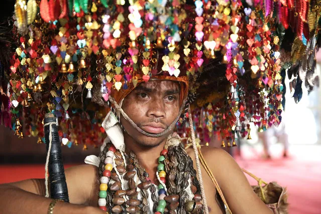 An Indian tribal man wearing traditional headgear and dress attends the inauguration of the first National Tribal Carnival in New Delhi, India, 25 October 2016. The Indian prime minister Modi inaugurated event held to promote tribal culture in the country. More than 1,600 tribal artists and around 8,000 tribal delegates from across the country will participate in the five-day-long carnival. (Photo by Harish Tyagi/EPA)