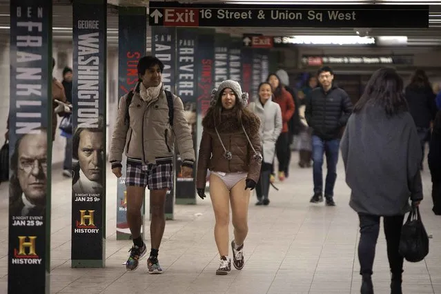 Participants walk as they take part in the “No Pants Subway Ride” in the Manhattan borough of New York January 11, 2015. (Photo by Carlo Allegri/Reuters)