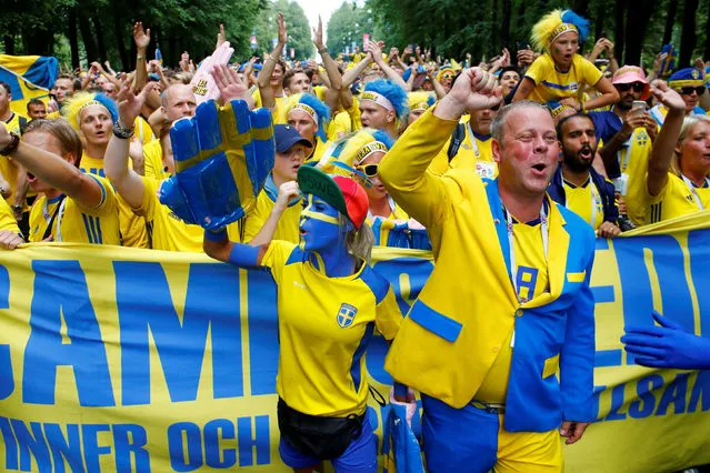 Sweden fans make their way to the stadium before the Russia 2018 World Cup round of 16 football match between Sweden and Switzerland at the Saint Petersburg Stadium in Saint Petersburg on July 3, 2018. (Photo by Anton Vaganov/Reuters)