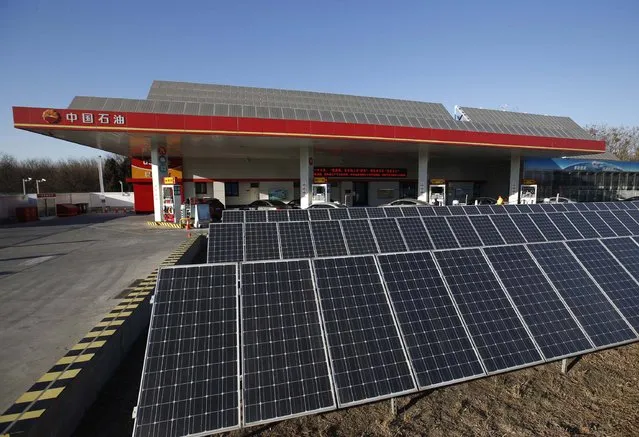 Solar panels are seen at PetroChina's solar-powered Yizhuang gas station in Beijing, January 9, 2015. (Photo by Kim Kyung-Hoon/Reuters)