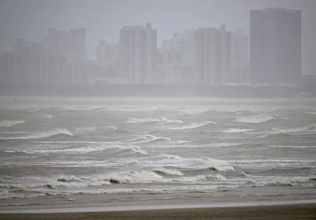 In this photo released by Xinhua News Agency, waves are seen off the coast of Fuzhou, southeast China's Fujian Province on Thursday, July 27, 2023. Typhoon Doksuri is expected to make landfall in China after bringing deadly landslides to the Philippines. (Photo by Wei Peiquan/Xinhua via AP Photo)