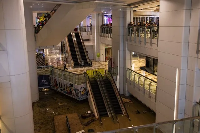 A shopping mall is flooded following heavy rainstorms in Hong Kong, Friday, September 8, 2023. Rain pouring onto Hong Kong and southern China overnight flooded city streets and some subway stations, halting transportation and forcing schools to close Friday. (Photo by Louise Delmotte/AP Photo)