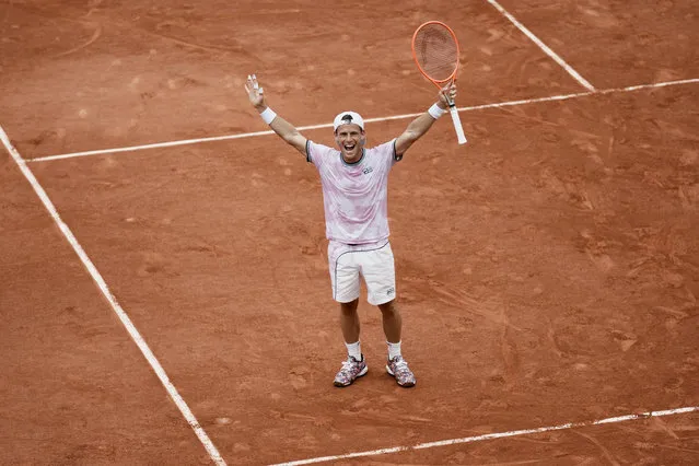 Argentina's Diego Schwartzman celebrates after defeating Germany's Jan-Lennard Struff during their fourth round match on day 9, of the French Open tennis tournament at Roland Garros in Paris, France, Monday, June 7, 2021. (Photo by Thibault Camus/AP Photo)