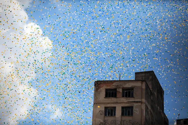 Some 50,000 biodegradable balloons are released at the Patio do Colegio square in sao Paulo, SP, Brazil, 30 December 2016. The tradition of releasing balloons weas steablished in 1992 to celebrate the New Year. (Photo by Fernando Bizerra Jr./EPA)