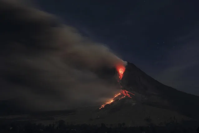 Mount Sinabung spews ash as seen from Jraya village in Karo district, January 13, 2014. (Photo by Reuters/Beawiharta)