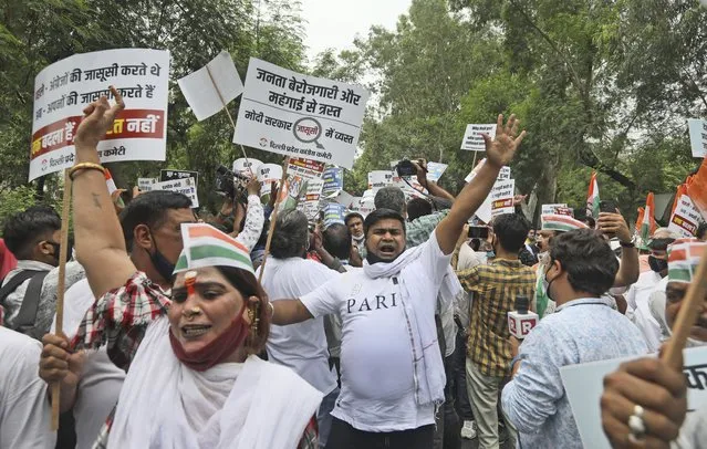 Congress party workers shout slogans during a protest accusing Prime Minister Narendra Modi’s government of using military-grade spyware to monitor political opponents, journalists and activists in New Delhi, India, Tuesday, July 20, 2021. The protests came after an investigation by a global media consortium was published on Sunday. Based on leaked targeting data, the findings provided evidence that the spyware from Israel-based NSO Group, the world’s most infamous hacker-for-hire company, was used to allegedly infiltrate devices belonging to a range of targets, including journalists, activists and political opponents in 50 countries. (Photo by Manish Swarup/AP Photo)