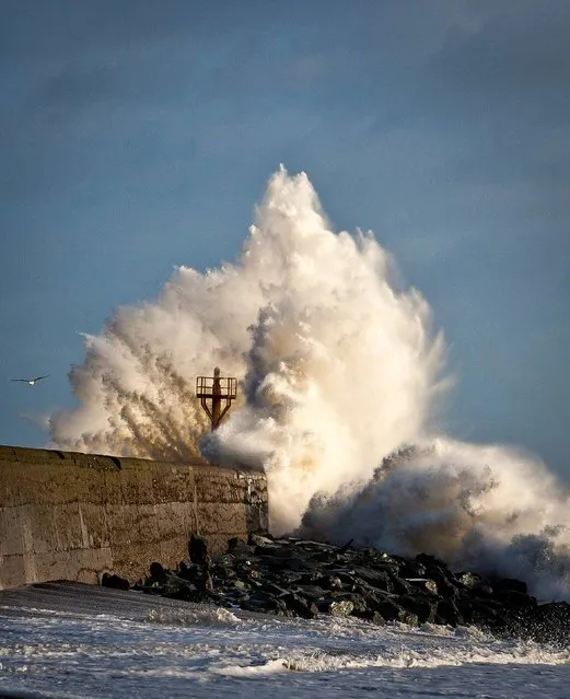 Giant waves break over the pier on the South beach, Arklow, Co Wicklow as high winds continue to lash the country, on December 27, 2013. (Photo by Garry O'Neill/PA Wire)