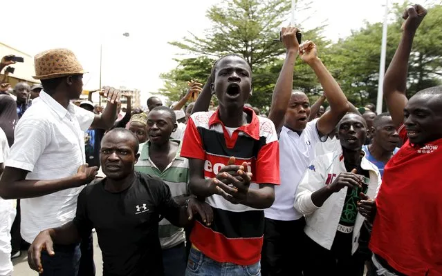 People cheer and dance outside the Radio Publique Africaine (RPA) broadcasting studio during protests against the decision made by Burundi's ruling National Council for the Defence of Democracy-Forces for the Defence of Democracy (CNDD-FDD) party to allow President Pierre Nkurunziza to run for a third five-year term in office, in the capital Bujumbura, April 26, 2015. (Photo by Thomas Mukoya/Reuters)