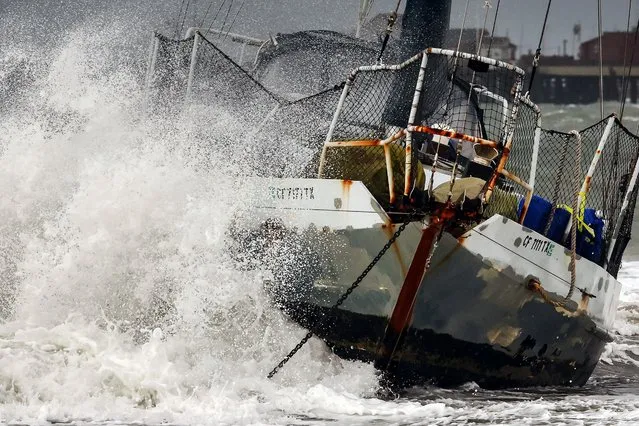 A wave hits a boat which washed ashore as a powerful long-duration atmospheric river storm, the second in less than a week, impacts California on February 4, 2024 in Santa Barbara, California. The storm is delivering potential for widespread flooding, landslides and power outages while dropping heavy rain and snow across the region. (Photo by Mario Tama/Getty Images)