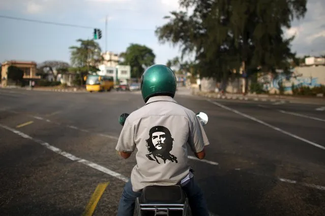A man wears a shirt with an image of the late revolutionary hero Ernesto “Che” Guevara in Havana, March 18, 2016. (Photo by Alexandre Meneghini/Reuters)
