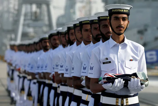 Pakistan Navy's servicemen carry national flags of participating countries during the opening ceremony of Pakistan Navy's Multinational Exercise AMAN-19, in Karachi, Pakistan February 8, 2019. (Photo by Akhtar Soomro/Reuters)