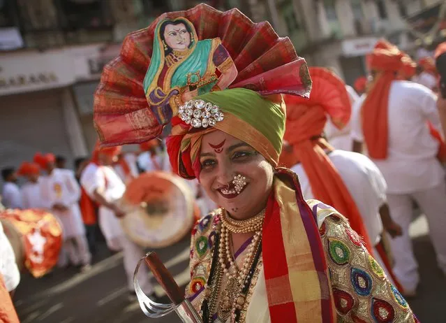 A Maharashtrian woman dressed in traditional costume attends celebrations to mark the Gudi Padwa festival in Mumbai, India, April 8, 2016. (Photo by Danish Siddiqui/Reuters)