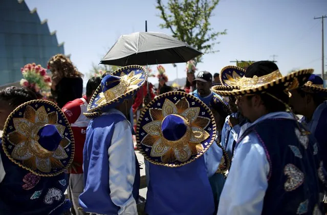 Matachines dancers stand together during a religious festival in Saltillo, Mexico, April 17, 2016. (Photo by Daniel Becerril/Reuters)